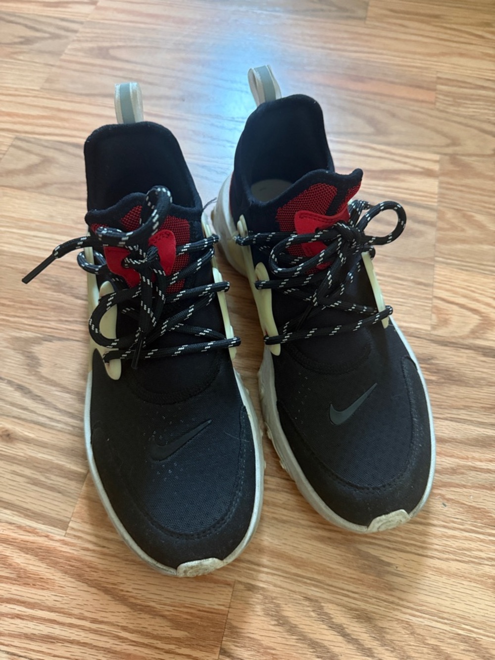 Nike Kids Black Sneakers with Red Tongue and Cream Accents